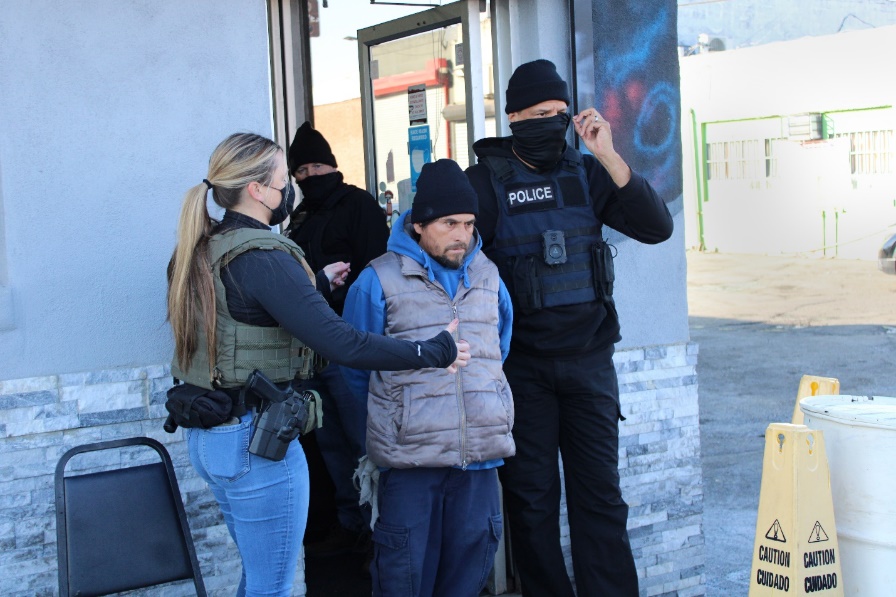 ICE and its federal law enforcement partners take an illegal alien into custody at a Philadelphia car wash Jan. 25 during an enhanced immigration enforcement operation.