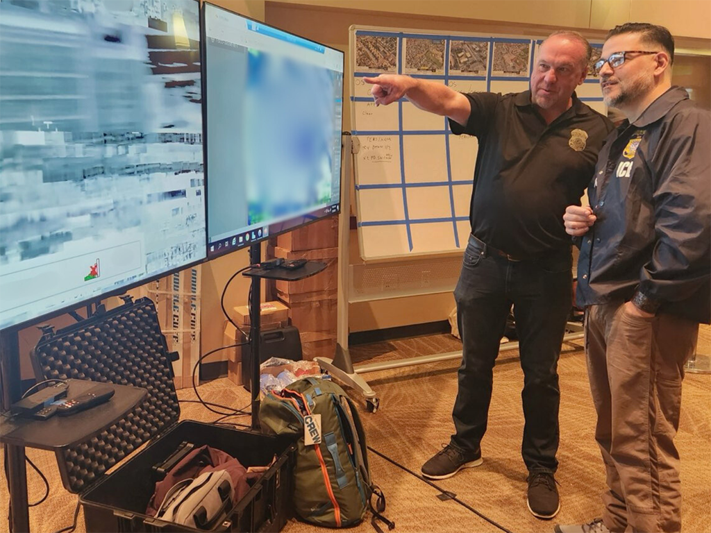 U.S. Immigration and Customs Enforcement Special Agent in Charge Tim Lenzen and ICE acting Director Caleb Vitello reviewing plans for an enhanced immigration enforcement operation at the Operations Command Center in Denver Feb. 5.