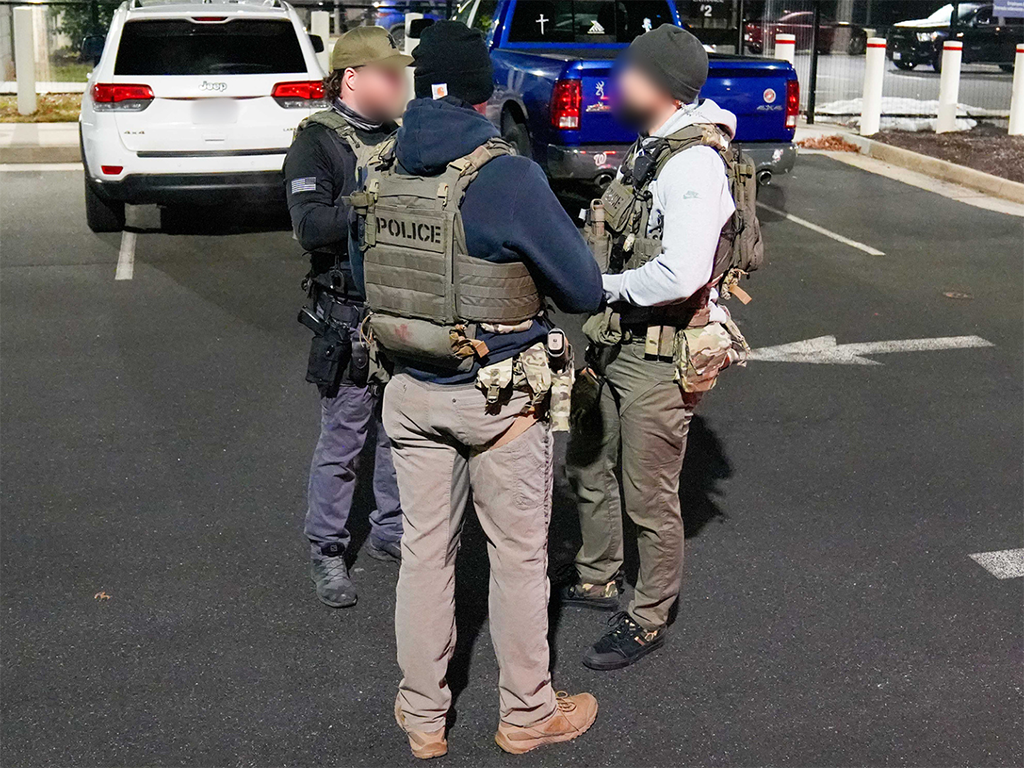 Federal law enforcement officials map out tactical plans before beginning an enhanced immigration enforcement operation near Washington, D.C. Feb. 4.