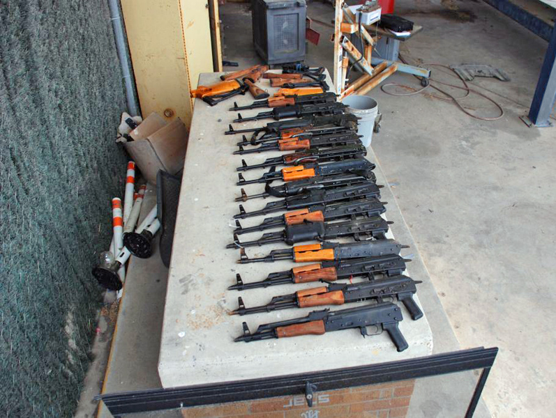 15 AK47 assault type rifles that were discovered hidden inside a pickup truck