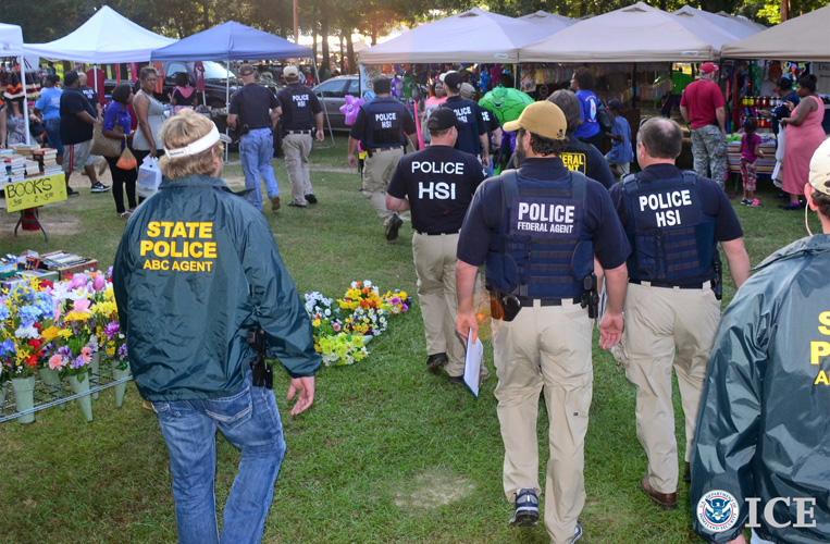 ICE HSI special agents along with Alabama state police enter an Alabama flea market Saturday to seize counterfeit items from nearly 50 vendors operating illegally on the premises.