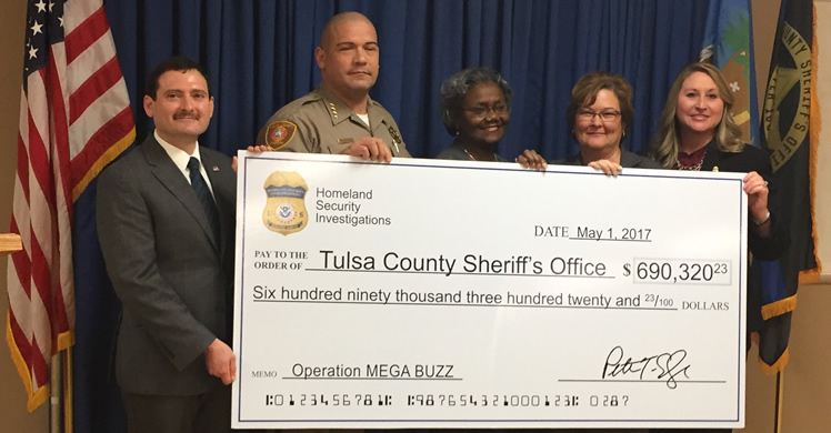 The check for $690,320.23 represents TCSO’s share of monies and assets seized from one defendant in Operation MEGA BUZZ, which is divided among the participating agencies as part of ICE's asset-sharing agreement