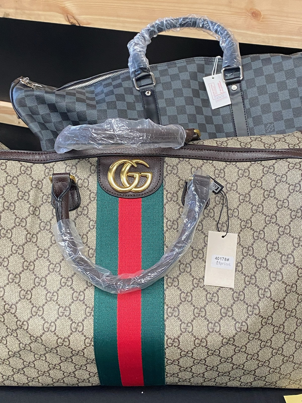 Over 1,000 items were confiscated, including several boxes of luxury designer goods such as high-end purses, caps, shoes and sunglasses.